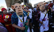 Residents of Santa Cruz Meyehualco in Iztapalapa take part in a parade as part of the Sant...