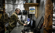 A soldier works at a control panel as the unit uses RQ-35 Heidrun and A1-CM ''Furia'' dron...