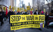 Demonstrators march to Trump Tower in New York City, USA, on March 2, 2026, denouncing the...