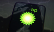 The logo of the energy group BP (British Petroleum) appears on a smartphone screen placed...
