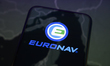 The logo of the tanker operator Euronav appears on a smartphone screen placed on a reflect...