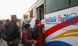 Nepali voters board vehicles to return to their hometowns to exercise their franchise in t...