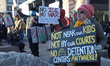 Residents protest plans to move the local immigration office to the federal building downt...