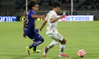 Adalberto Carrasquilla #28 of Pumas and Diego Barbosa #2 of Toluca compete for the ball du...
