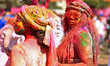 A tourist is smeared in 'gulal' colors during an event organized by Rajasthan Tourism for...