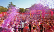 Tourists are smeared in 'gulal' colors during an event organized by Rajasthan Tourism for...