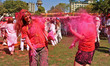 Tourists are smeared in 'gulal' colors during an event organized by Rajasthan Tourism for...