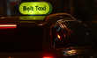 BUDAPEST, HUNGARY – MARCH 4: A Bolt Taxi vehicle with its illuminated green roof sign is...