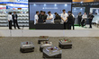Industry professionals and visitors explore the HYUNDAI MOVEX booth during the second day...