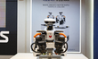 Industry professionals and visitors explore the T-Robotics booth during the second day of...