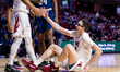 Gavin Griffiths of the Temple Owls is helped up during an NCAA men's basketball game at Th...