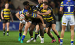 Justin Sangare and Denive Balmforth tackle Josh Smith during the BetFred Super League matc...
