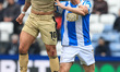 Sam Nombe of Rotherham battles with Murray Wallace of Huddersfield during the Sky Bet Leag...