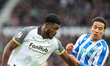 Patrick Agyemang of Derby County and Gabriel Otegbayo of Sheffield Wednesday battle for po...