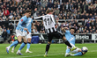 Abdukodir Khusanov of Manchester City blocks a shot from Harvey Barnes of Newcastle United...