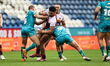 Taane Milne is tackled during the BetFred Super League match between Huddersfield Giants a...