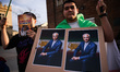 Protesters hold banners with a picture of Reza Pahlavi while attending demonstration in su...