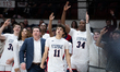 Jack Coco and the Stepinac bench hold up 3's after a shot during the Catholic High School...