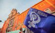 A woman holds a feminist flag while taking part in a demonstration in Queretaro, Mexico, o...