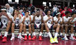 Stepinac players throw up 4's to show history being made as the first team to win 4 champi...