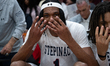 Darius Ratliff signals history being made as the first team wins four consecutive titles i...