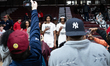 Twins, Darius and Adonis Ratliff, pose for a picture surrounded by media during the Cathol...