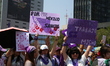 Women participate in a rally for the International Women's Day commemoration, demanding an...