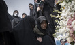 An Iranian woman grieves at the grave of her relative who is killed during the U.S.-Israel...