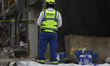 Members of the Navy guard the collapsed building in San Antonio Abad, Mexico City, on Marc...