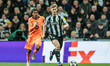 Lewis Hall of Newcastle United breaks with the ball, tracked closely by Lamine Yamal of Ba...