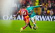 Wilfried Stephane Singo of Galatasaray A.S. puts pressure on Florian Wirtz of Liverpool FC...