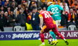 Abdulkerim Bardakci of Galatasaray A.S. is in action with Hugo Ekitike of Liverpool FC dur...