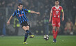 Marten de Roon of Atalanta B.C. and Joshua Kimmich of F.C. Bayern Munchen are in action du...