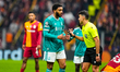 Joe Gomez of Liverpool FC receives a warning from the referee during the UEFA Champions Le...