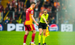 Roland Sallai of Galatasaray SK receives a warning from assistant referee Guadalupe Porras...