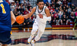 Jaiden Glover-Toscano, 11, of the St. Joseph's Hawks drives the ball during an NCAA men's...