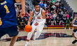 Jaiden Glover-Toscano, 11, of the St. Joseph's Hawks drives the ball during an NCAA men's...
