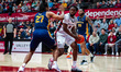 ANTHONY FINKLEY (5) of the St. Joseph's Hawks possesses the ball while EDWIN DANIEL (27) o...