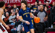 Ashton Walker of the La Salle Explorers possesses the ball during an NCAA men's basketball...