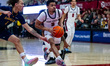 KHAAFIQ MYERS (3) of the St. Joseph's Hawks drives the ball while ASHTON WALKER (1) of the...