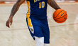 Jaden Johnson (10) of the La Salle Explorers possesses the ball during an NCAA men's baske...