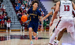 Ashton Walker of the La Salle Explorers possesses the ball during an NCAA men's basketball...