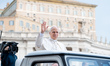 Pope Leo XIV waves to the crowd during the weekly general audience at St Peter's Square in...