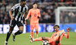 Lamine Yamal of Barcelona is fouled by Joe Willock of Newcastle United during the UEFA Cha...