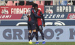 Jonathan Rowe of Bologna FC celebrates with a teammate during the Bologna FC vs Hellas Ver...