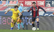 Nadir Zortea of Bologna FC competes for the ball with Domagoj Bradaric of Hellas Verona FC...