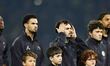 PSG players stand ahead of the UEFA Champions League round of 16 first leg football match...