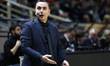 PAOK coach Pantelis Boutskos gives instructions to his team's players during the PAOK-Peri...
