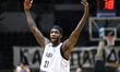 PAOK player Patrick Beverley (C) celebrates during the PAOK-Peristeri match for the first...