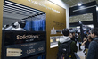 Visitors look at the Samsung SDI ''SolidStack'' booth featuring all-solid-state battery te...